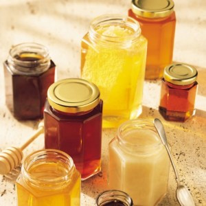 Bees make many kinds of honey that vary by color, aroma, and texture.  The variation comes from the kind of nectar the bees harvested to make the honey.