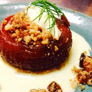 Apple Tarte Tatin: on buckwheat sable, served with creme fraiche anglaise, golden raisins, and pecan streusel 